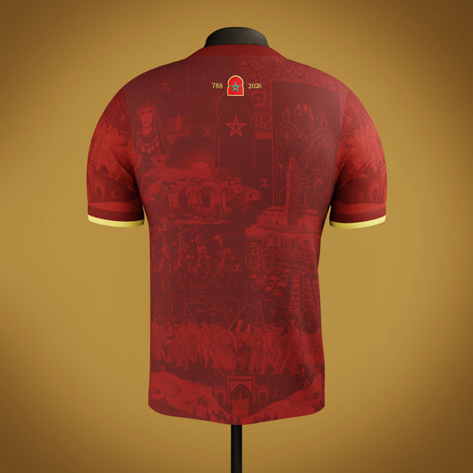 Red Moroccan jersey with intricate heritage patterns on a mannequin against a gold/cream background