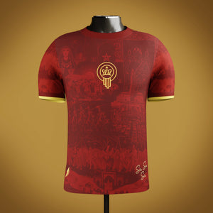 Red Moroccan heritage jersey with an embroidered emblem on a mannequin against a gold/cream background